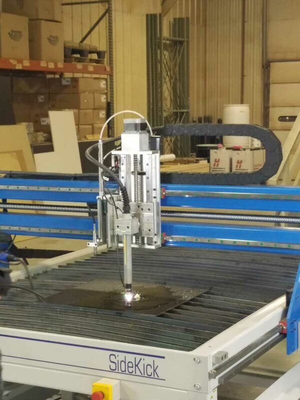 a plasma cutter cutting a piece of metal