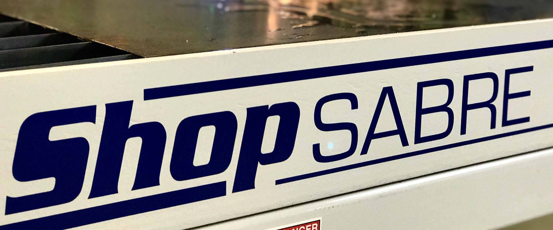 ShopSabre logo on a machine