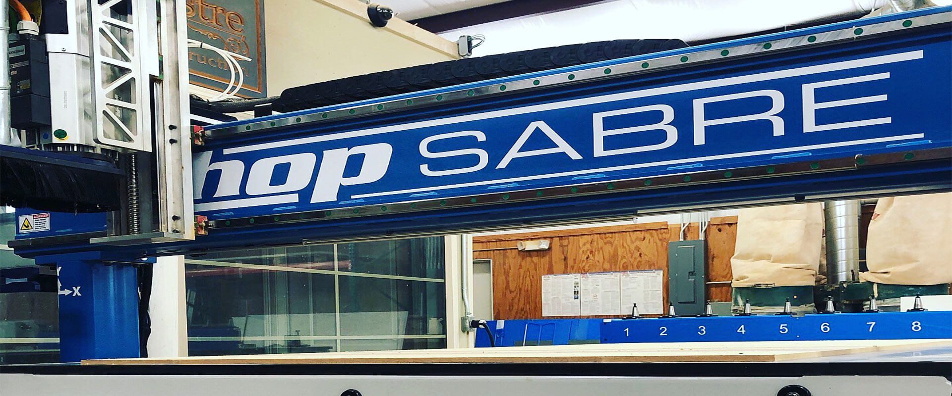 ShopSabre logo on a machine in a shop