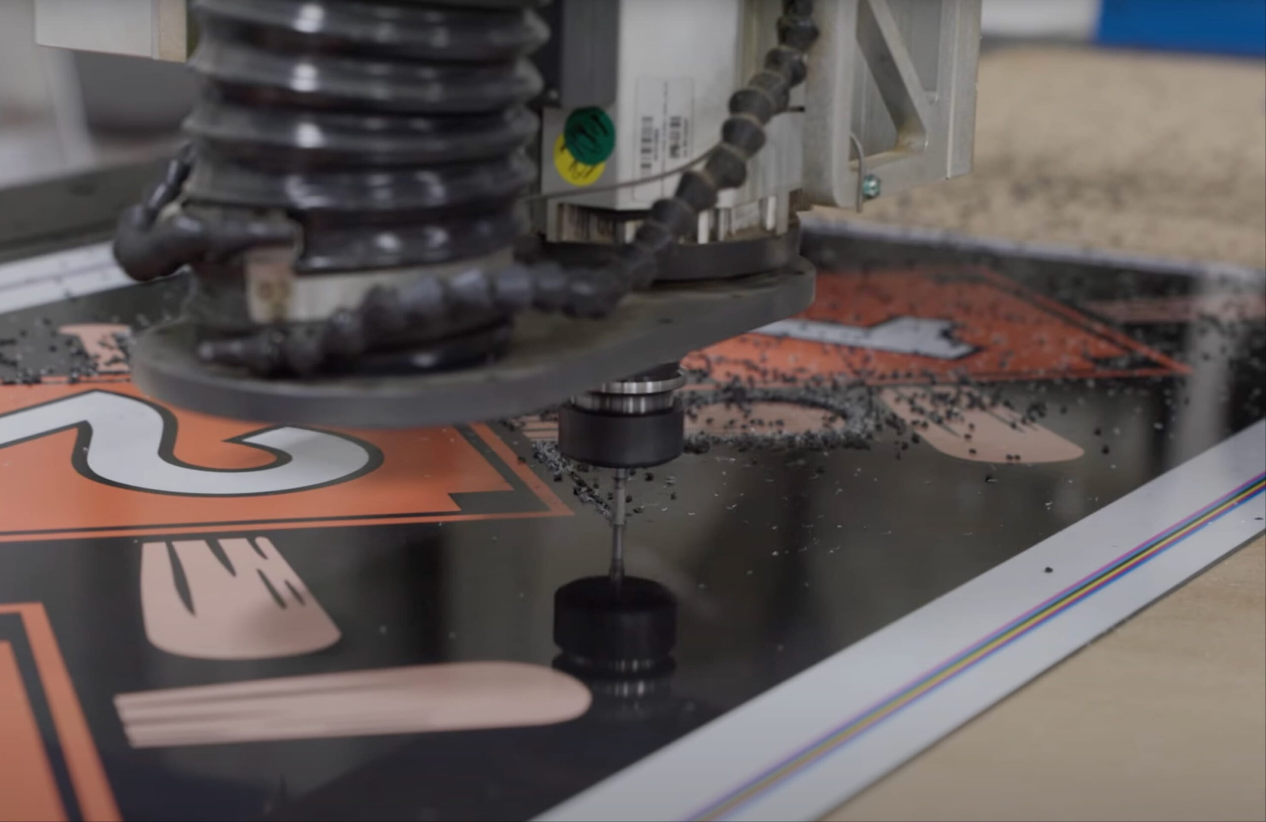 cnc machine working on an aluminum sign