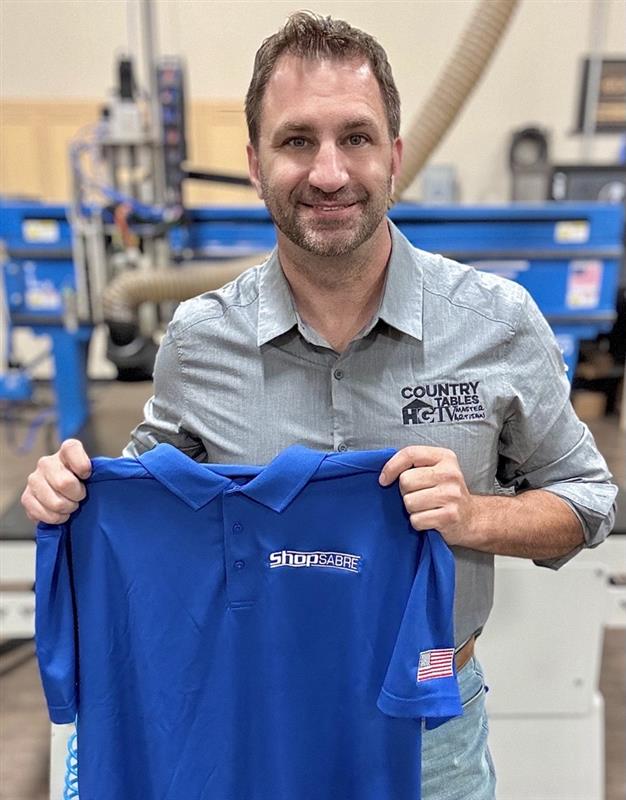 danny holding shopsabre shirt